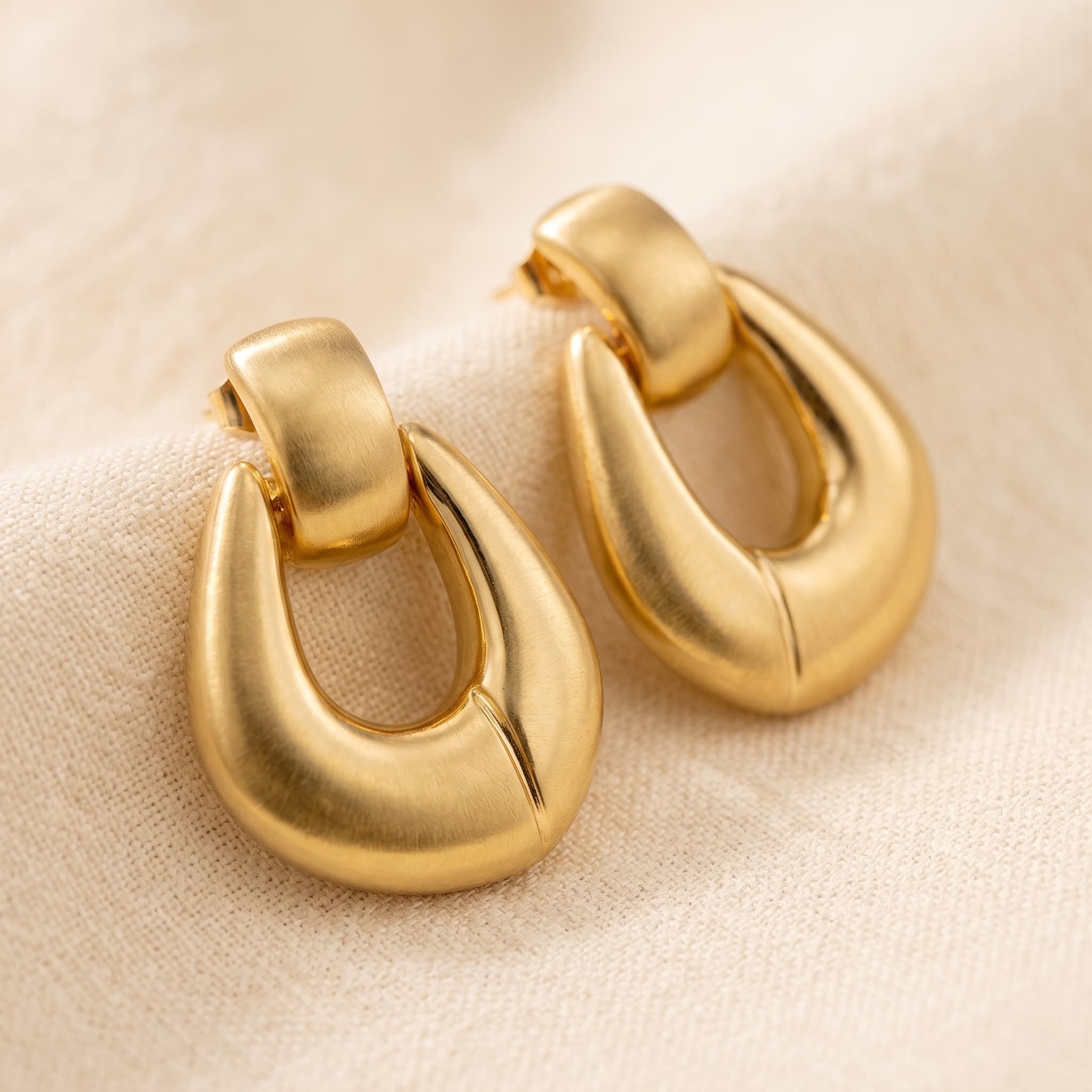 Statement gold earrings